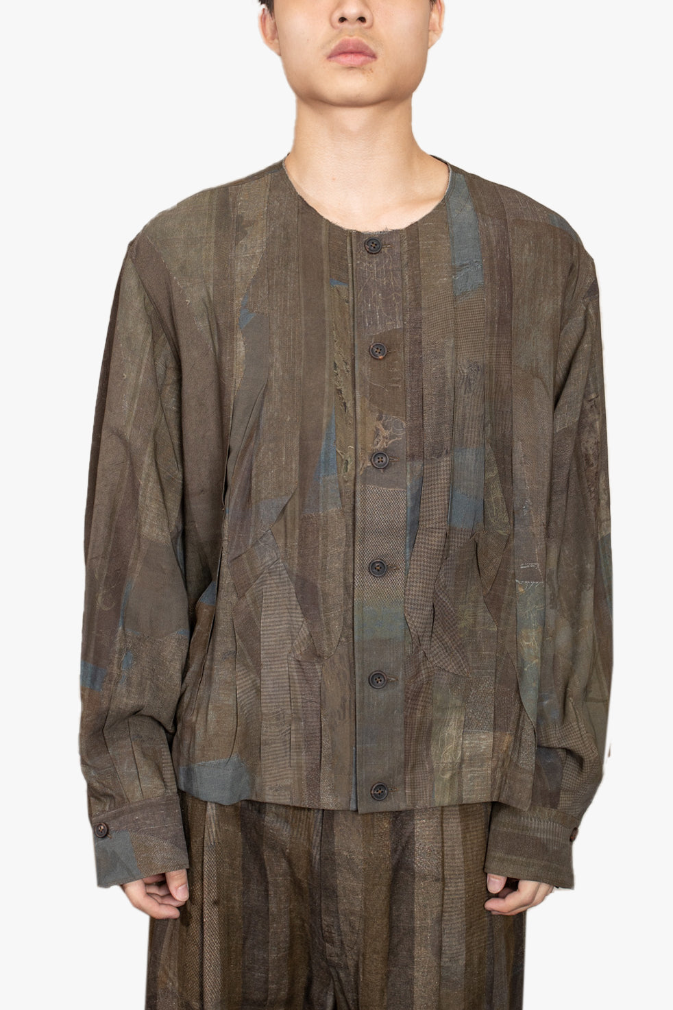 Multiple pleated collarless top